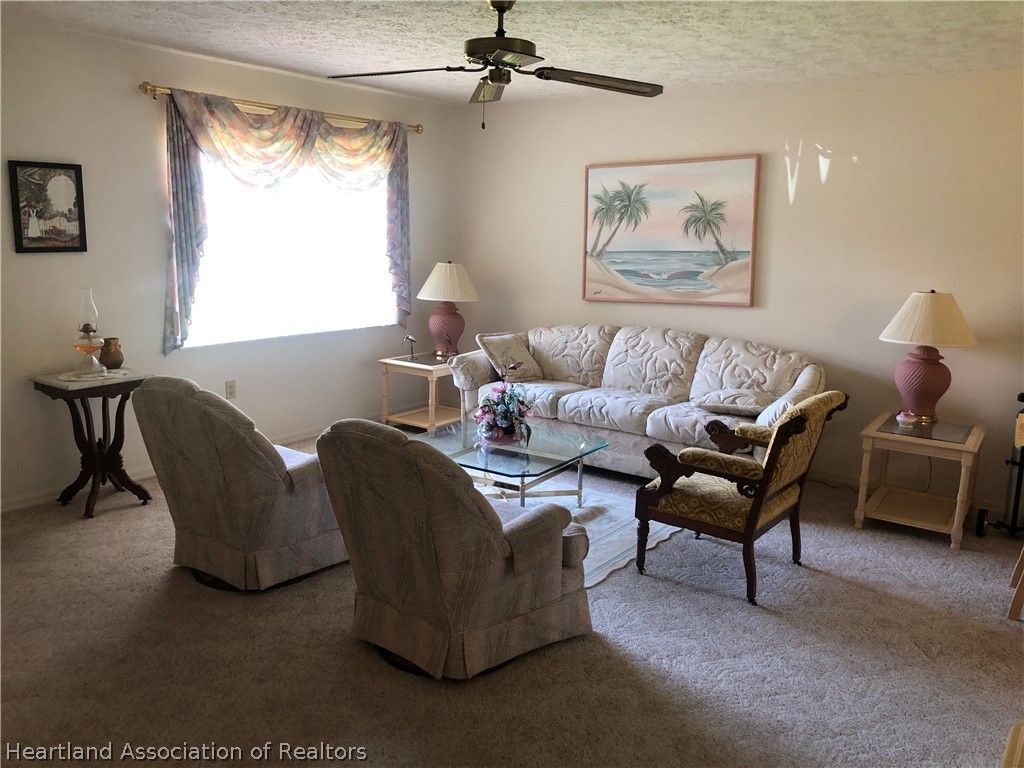 2510 Davis Circle Sebring, FL 33870 - Photo 2 of 23 a living room with furniture and a window