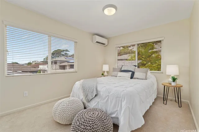 a bedroom with bed and window
