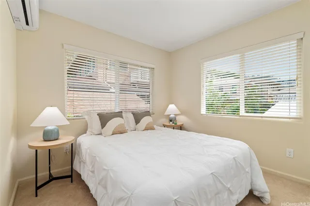 a bedroom with bed and a window