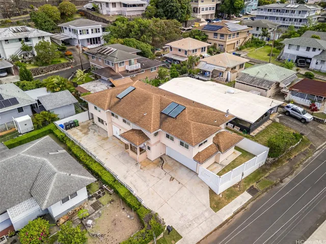an aerial view of residential houses and city view