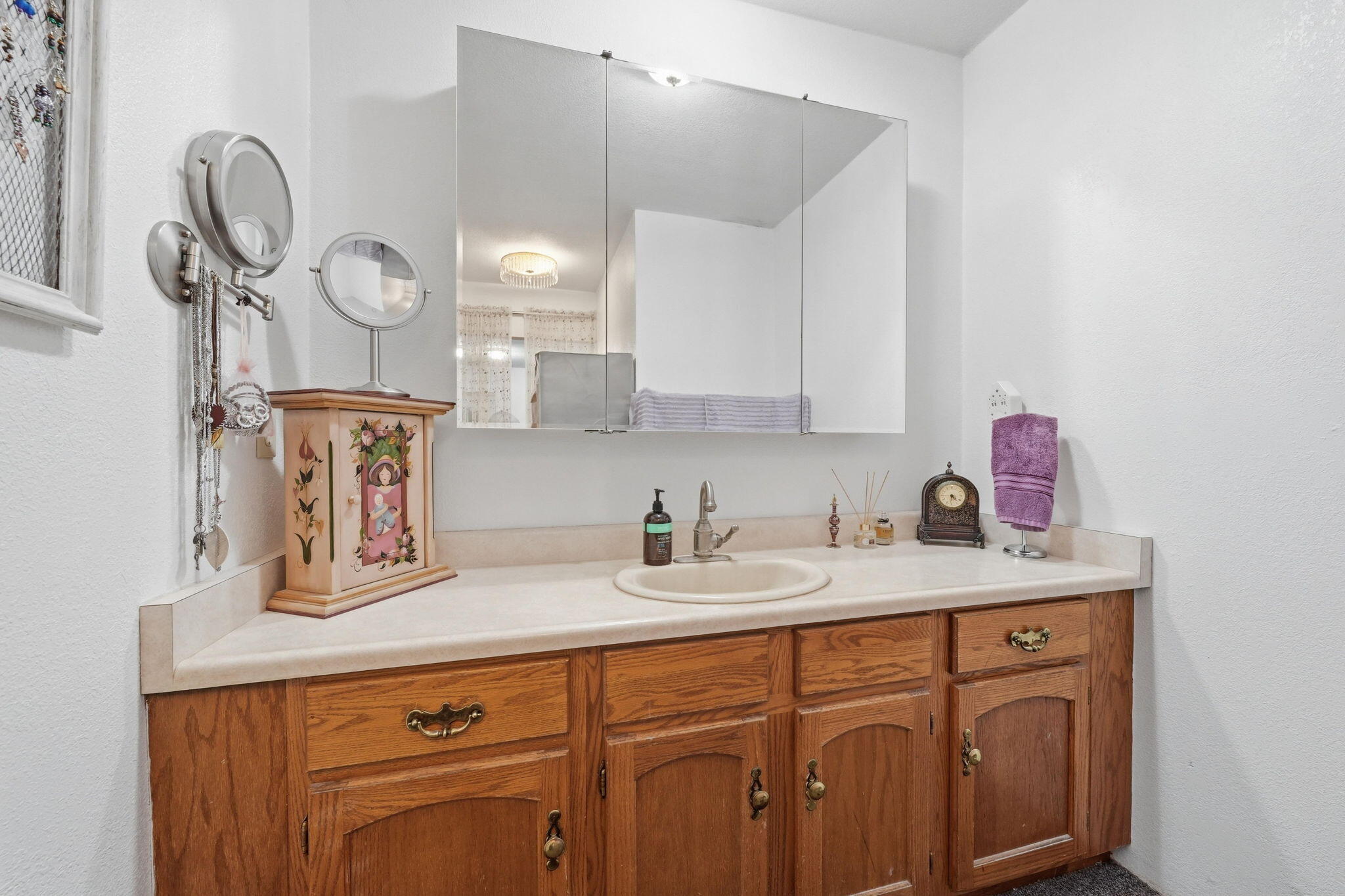 22189 Old Alturas Road Redding, CA 96003 - Photo 29 of 70 a bathroom with a sink vanity and mirror