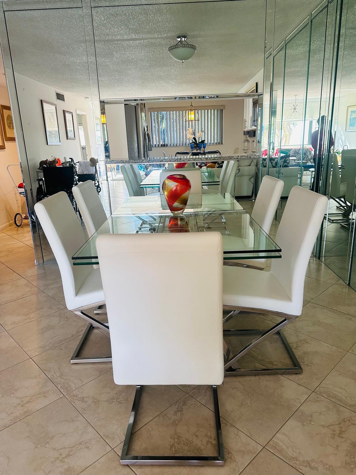 15075 Witney Road, Unit 211 Delray Beach, FL 33484 - Photo 11 of 23 a living room with a couch and a table