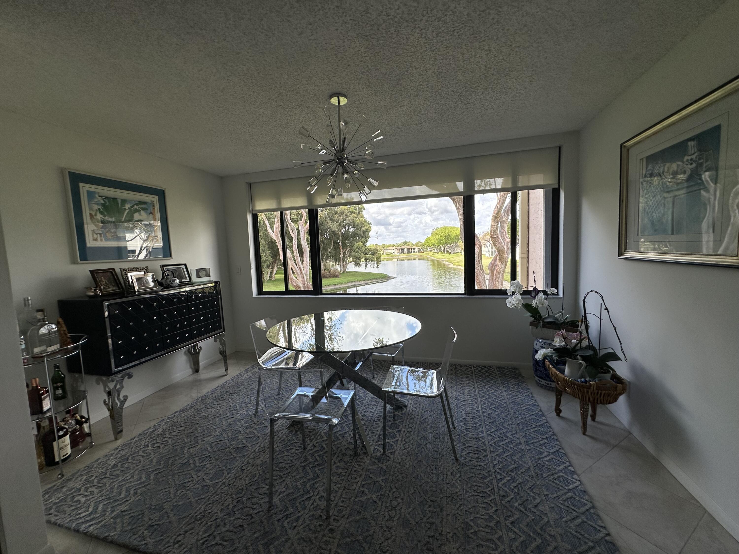 15075 Witney Road, Unit 211 Delray Beach, FL 33484 - Photo 4 of 23 a room with furniture and window