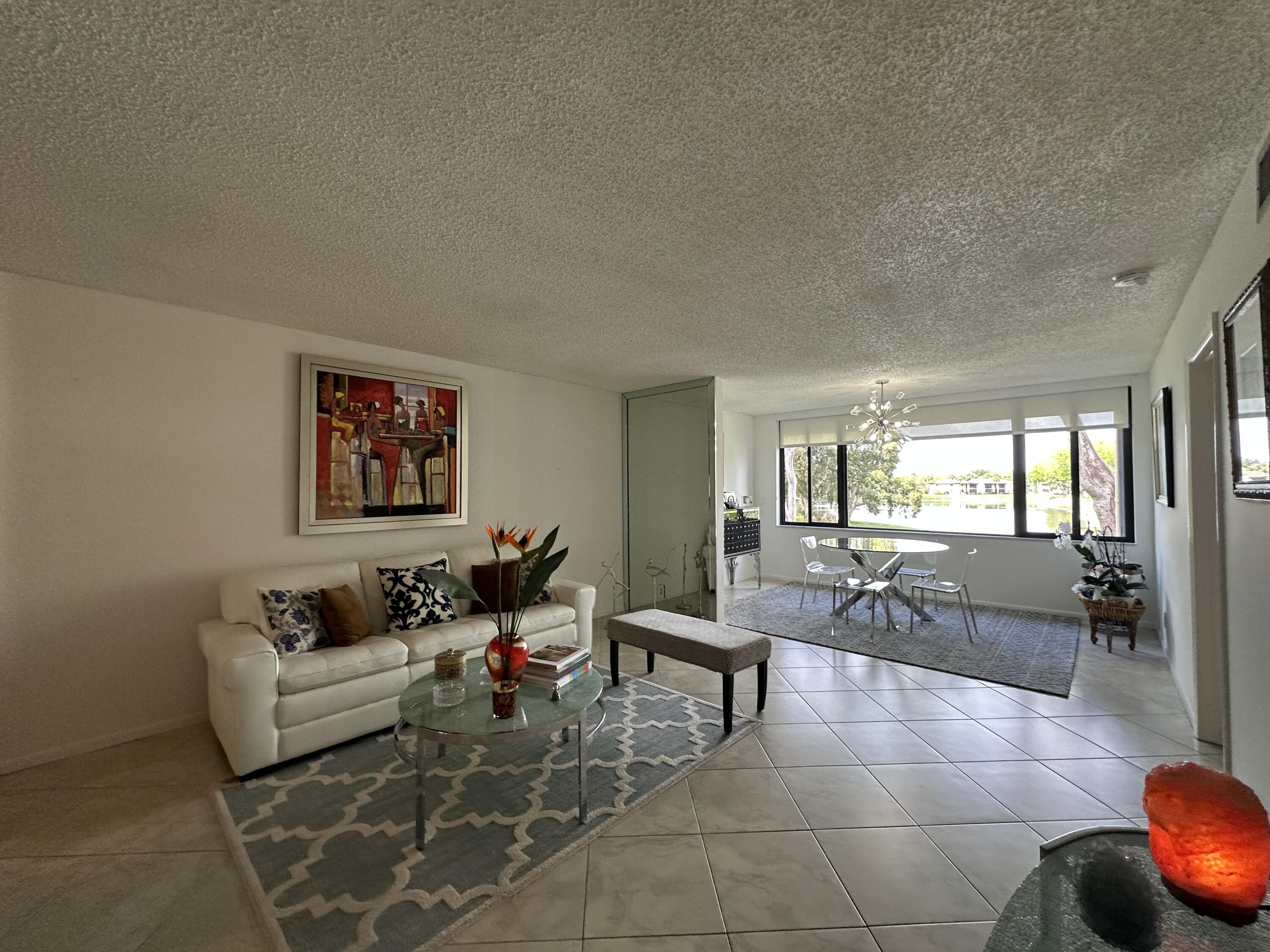 15075 Witney Road, Unit 211 Delray Beach, FL 33484 - Photo 5 of 23 a living room with furniture and a large window