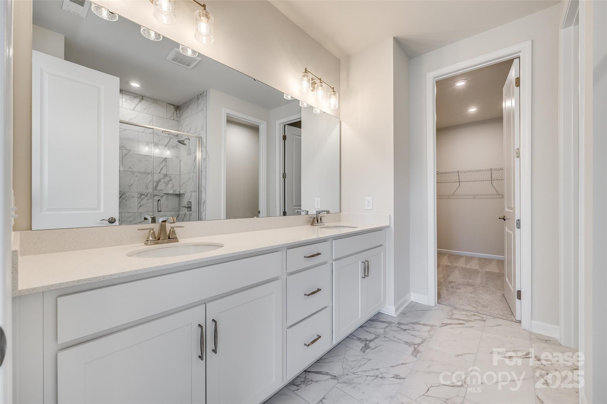 229 Brooks Springs Drive, Unit 34 Fort Mill, SC 29708 - Photo 19 of 31 a bathroom with a granite countertop sink mirror and