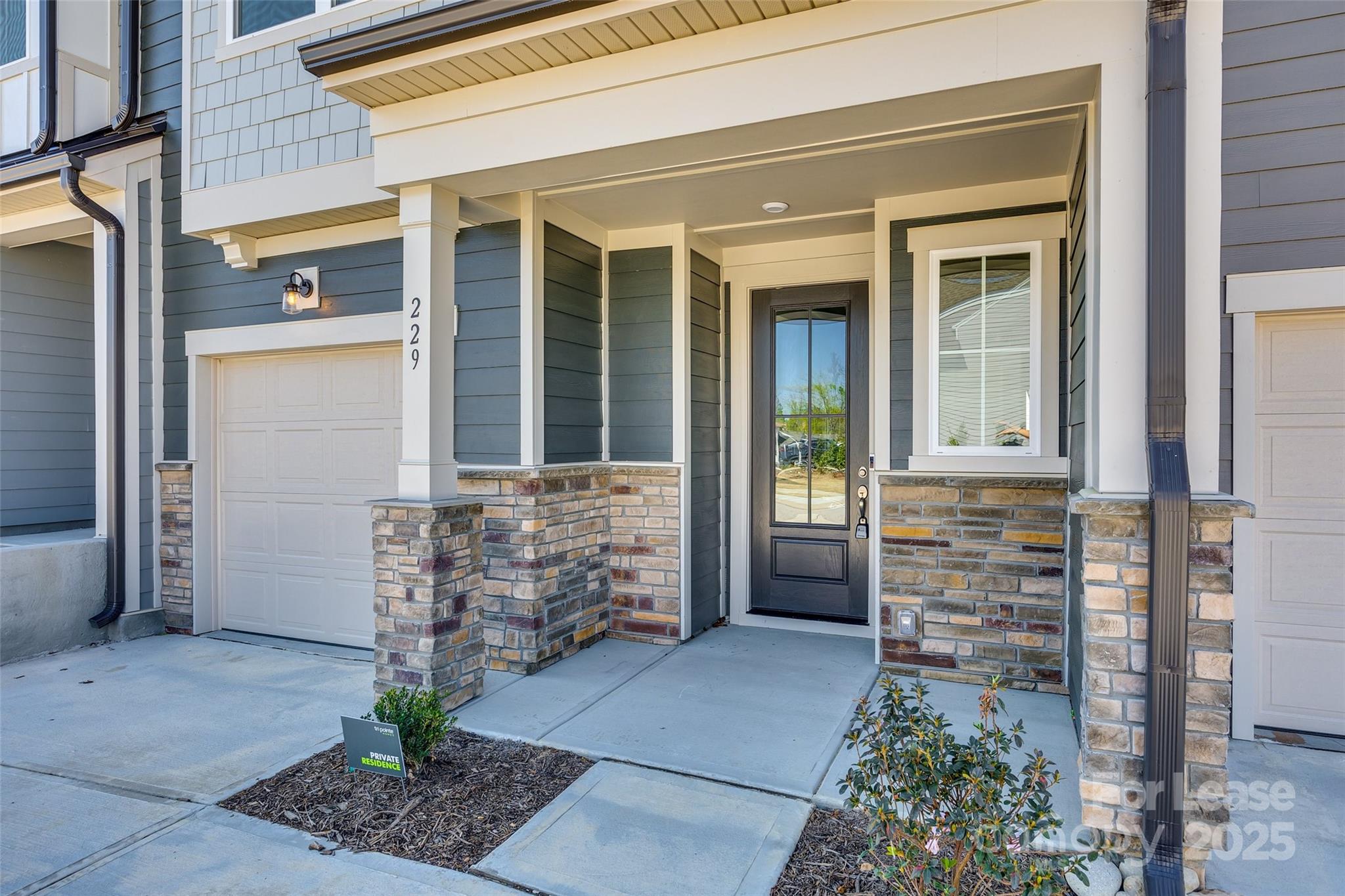 229 Brooks Springs Drive, Unit 34 Fort Mill, SC 29708 - Photo 2 of 31 front view of door with a potted plant