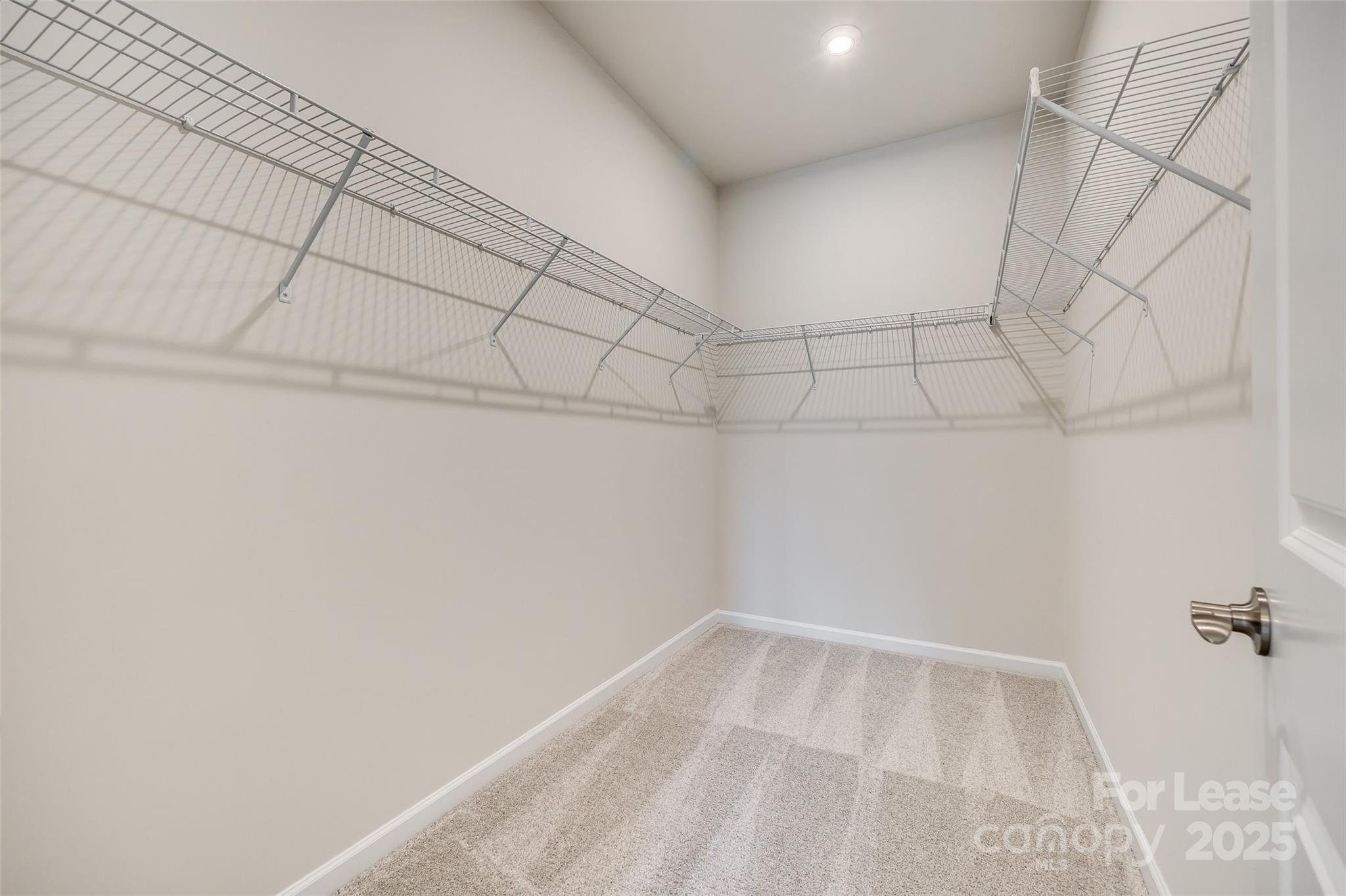 229 Brooks Springs Drive, Unit 34 Fort Mill, SC 29708 - Photo 21 of 31 a view of a room with racks on the wall