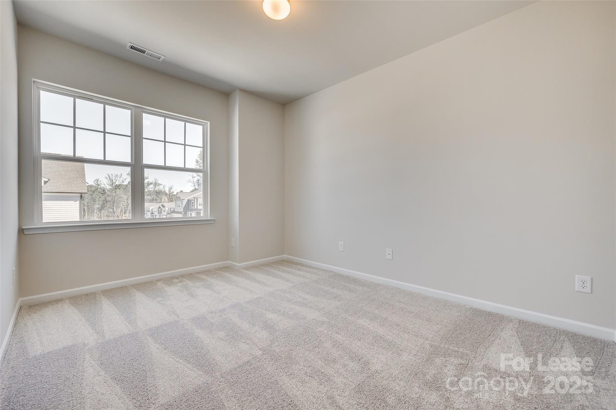 229 Brooks Springs Drive, Unit 34 Fort Mill, SC 29708 - Photo 22 of 31 an empty room with windows