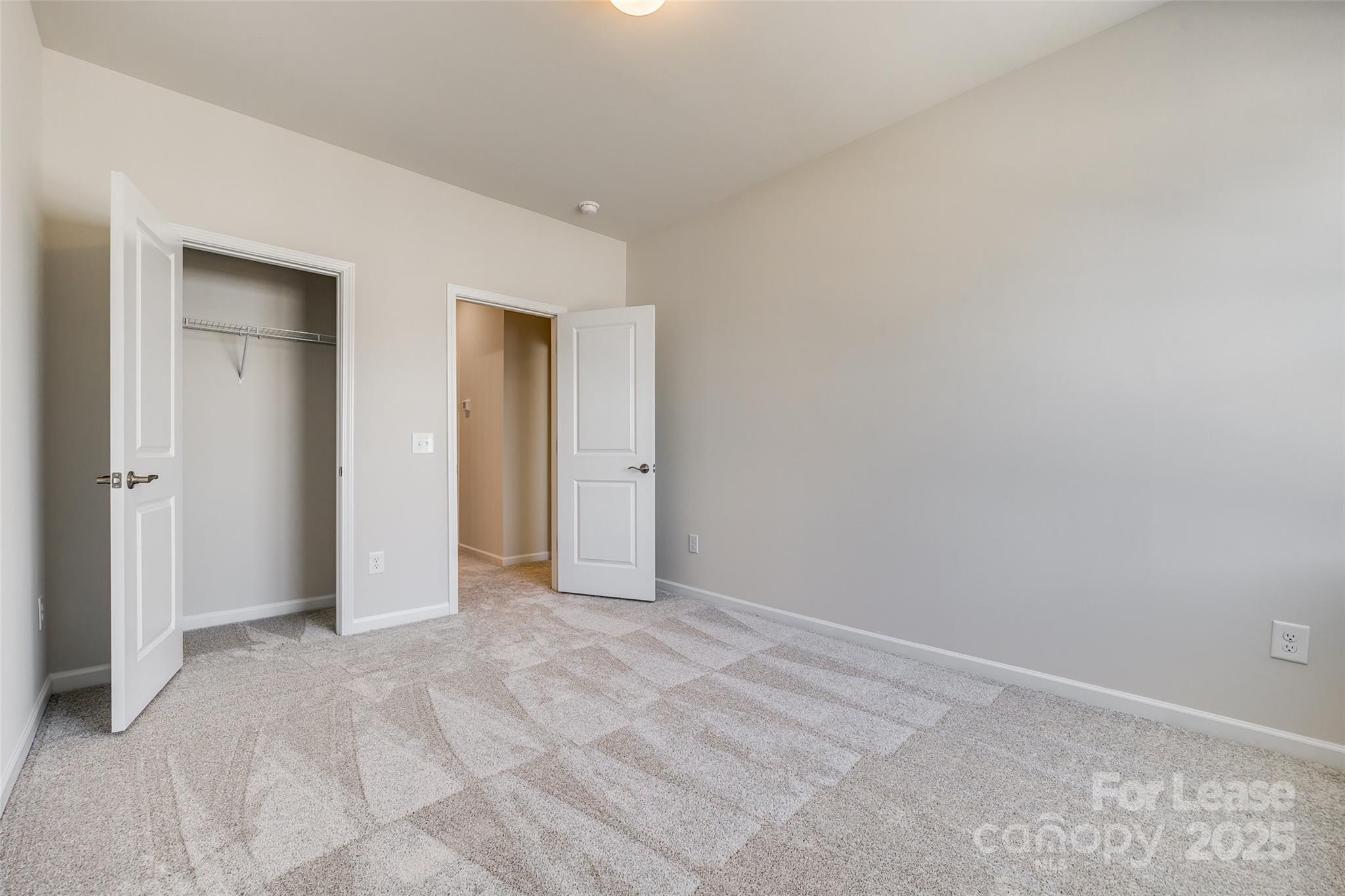 229 Brooks Springs Drive, Unit 34 Fort Mill, SC 29708 - Photo 23 of 31 an empty room with closet and a bathroom