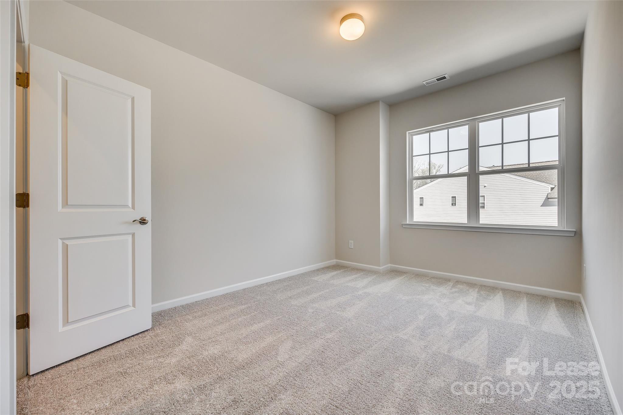 229 Brooks Springs Drive, Unit 34 Fort Mill, SC 29708 - Photo 24 of 31 an empty room with windows