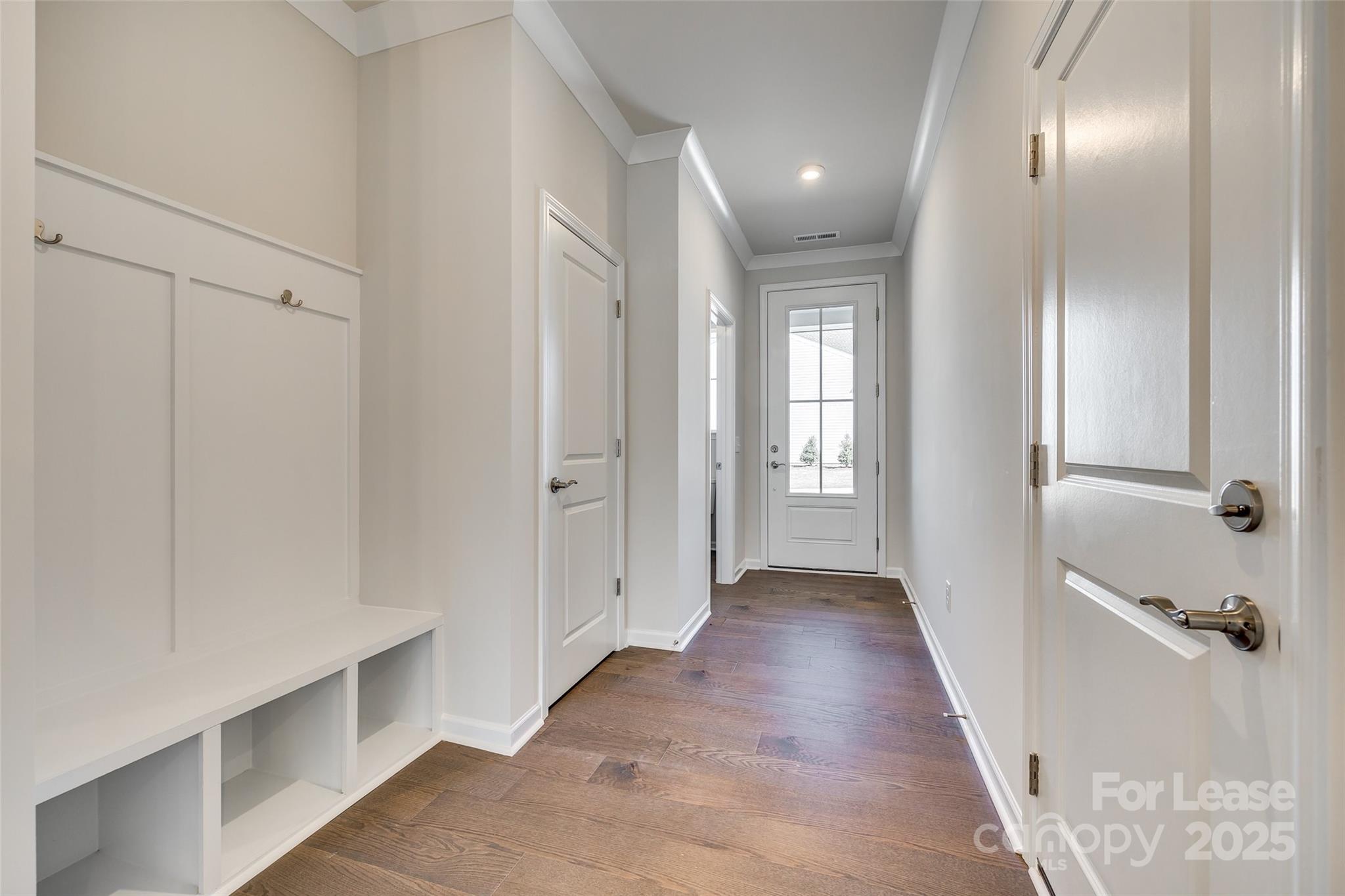229 Brooks Springs Drive, Unit 34 Fort Mill, SC 29708 - Photo 3 of 31 a view of a hallway with wooden floor