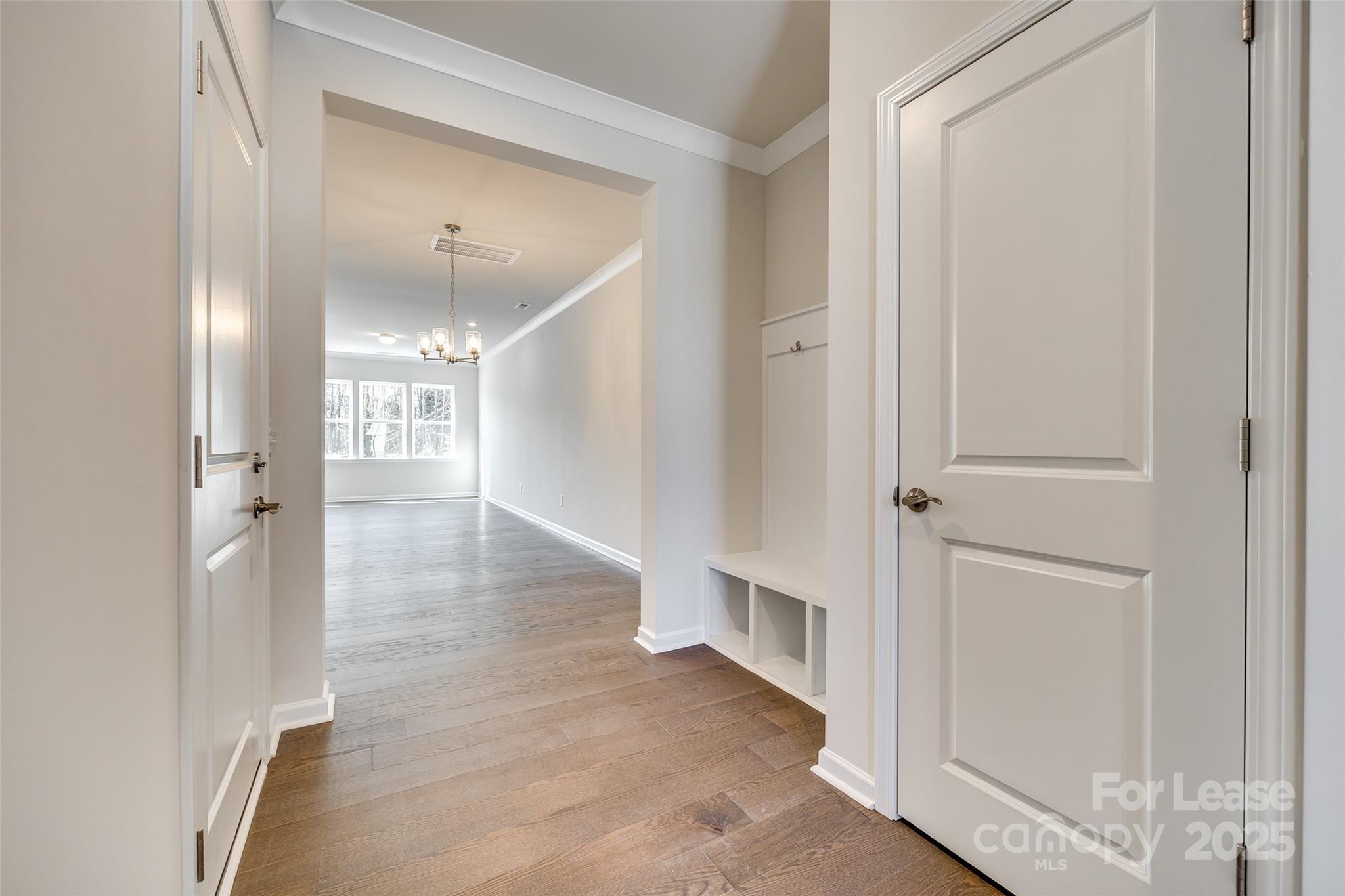 229 Brooks Springs Drive, Unit 34 Fort Mill, SC 29708 - Photo 4 of 31 a view of a hallway with wooden floor
