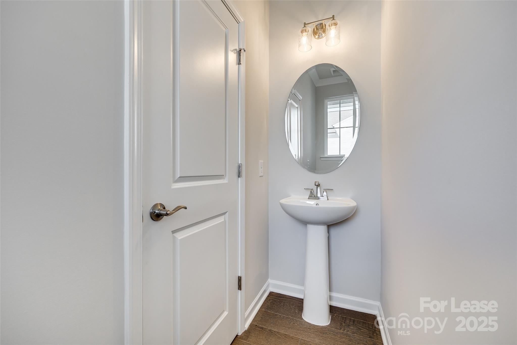 229 Brooks Springs Drive, Unit 34 Fort Mill, SC 29708 - Photo 5 of 31 a bathroom with a sink and a mirror