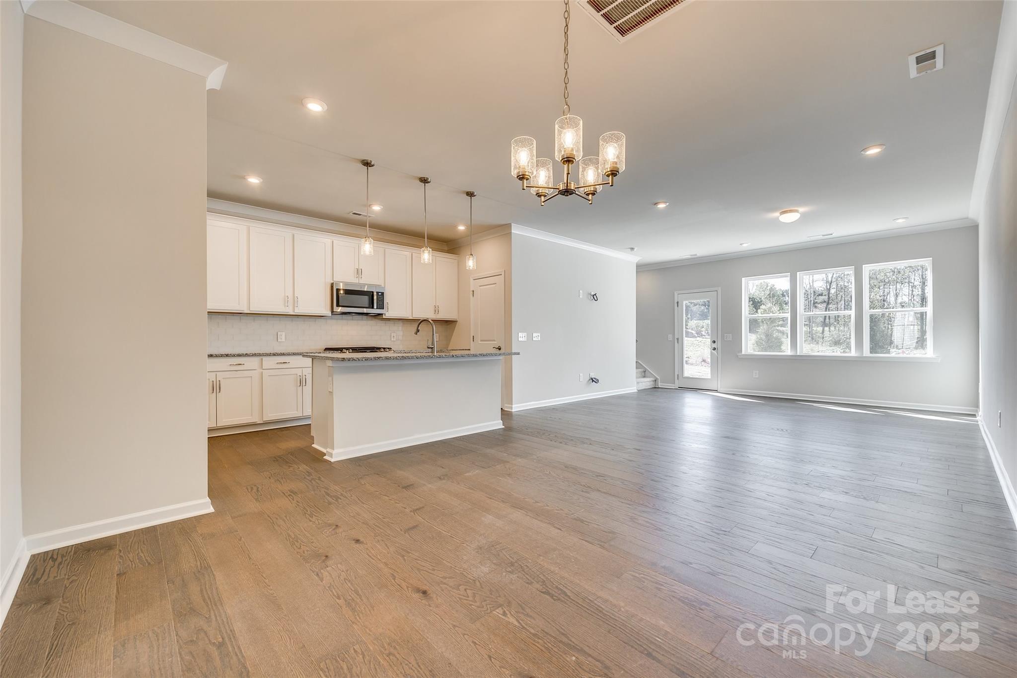 229 Brooks Springs Drive, Unit 34 Fort Mill, SC 29708 - Photo 6 of 31 a view of a kitchen with a sink cabinets and window