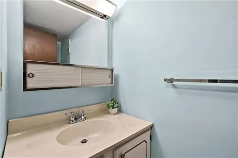 a bathroom with a sink and a mirror