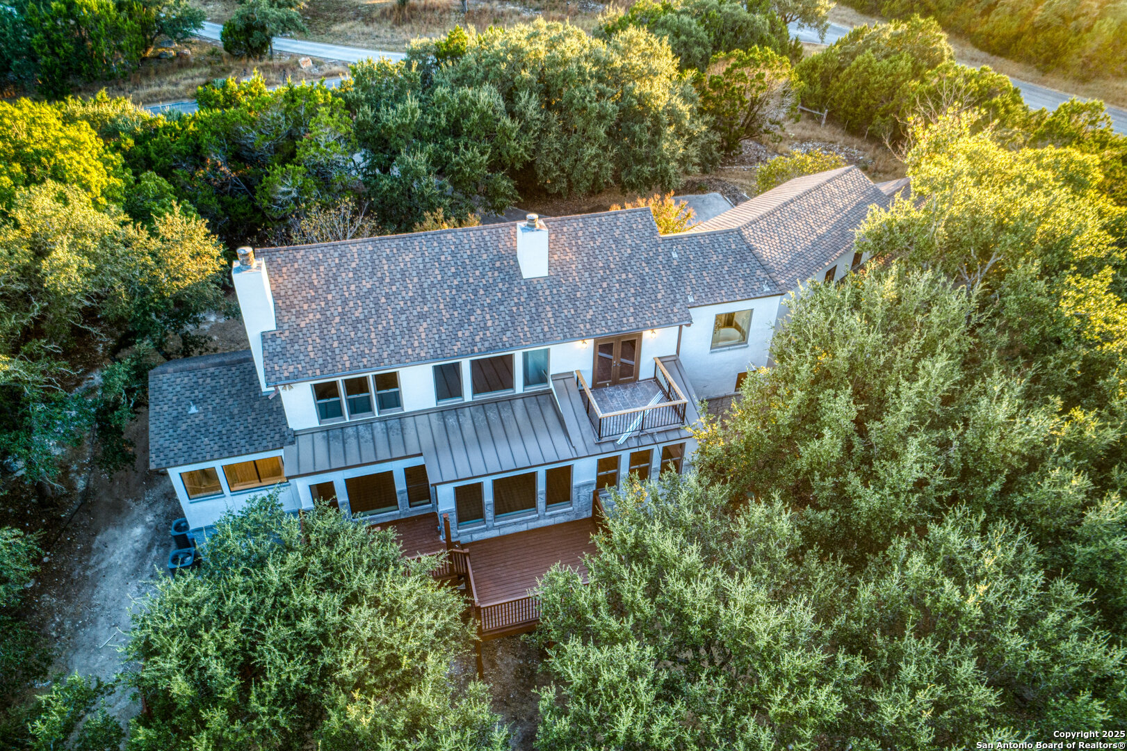 101 Ranch View Boerne, TX 78006 - Photo 11 of 63 an aerial view of a house with a yard and large trees