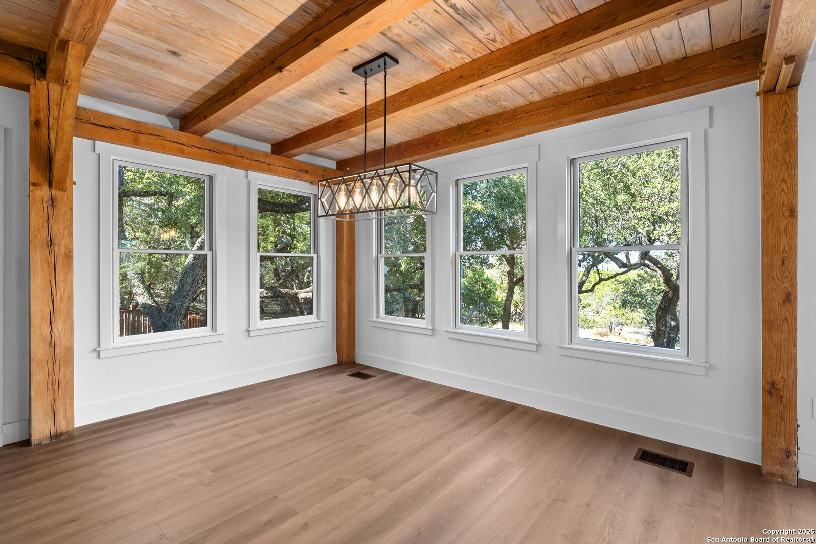 101 Ranch View Boerne, TX 78006 - Photo 24 of 63 a view of an empty room with wooden floor and a window