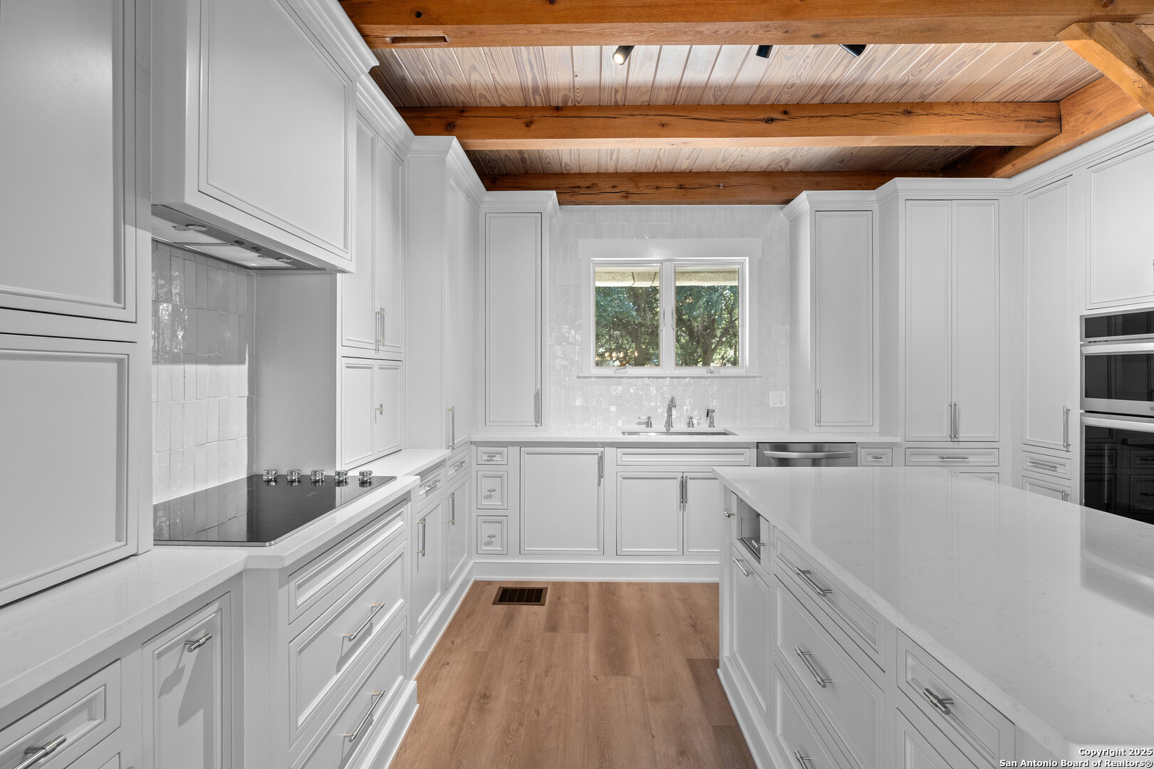 101 Ranch View Boerne, TX 78006 - Photo 30 of 63 a kitchen with granite countertop a sink a counter space appliances and cabinets