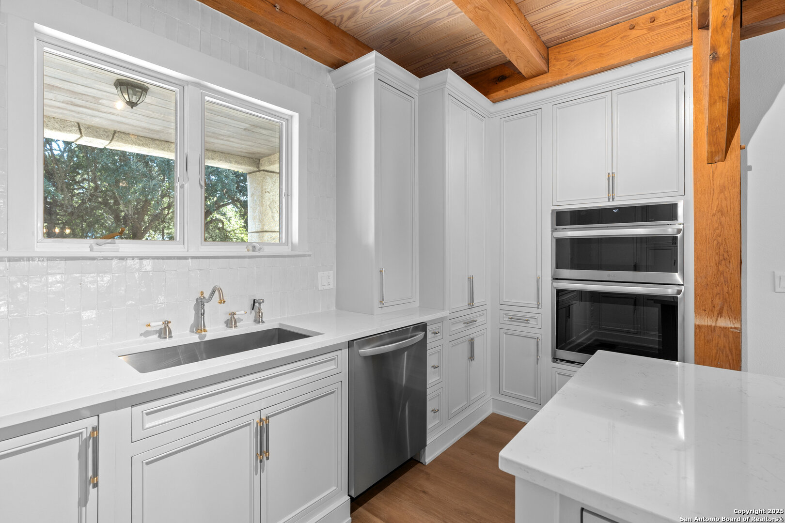 101 Ranch View Boerne, TX 78006 - Photo 31 of 63 a kitchen with a sink and a refrigerator
