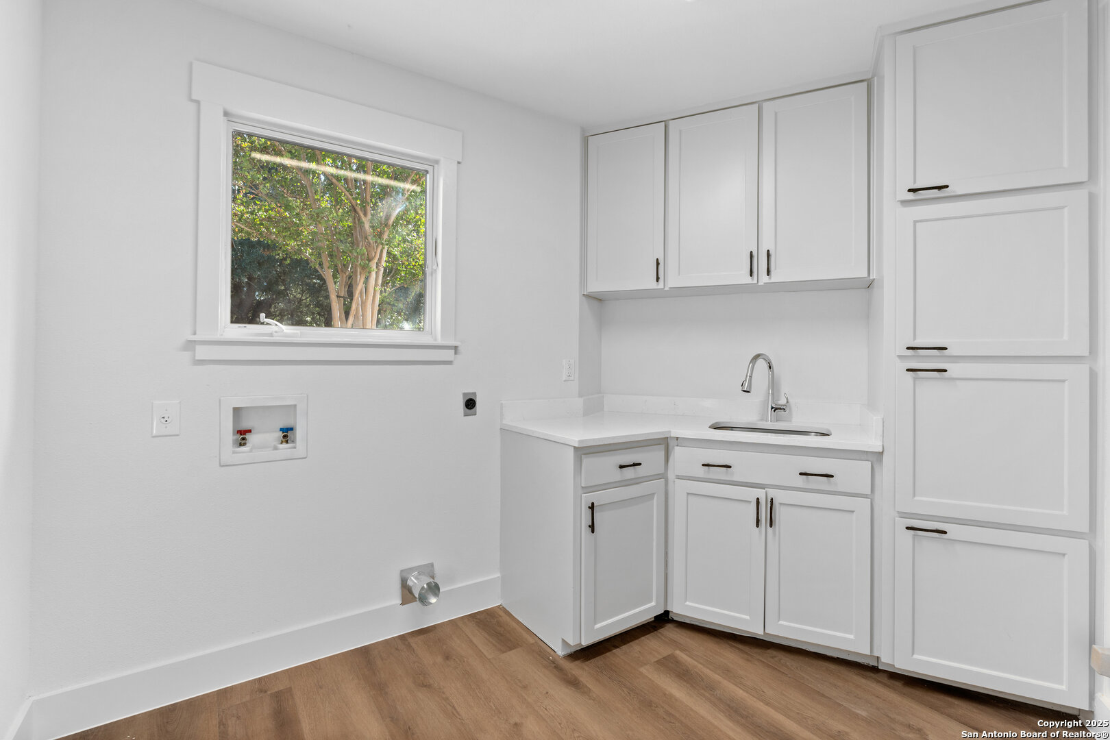 101 Ranch View Boerne, TX 78006 - Photo 32 of 63 a view of cabinets a wooden floor and a window in a room
