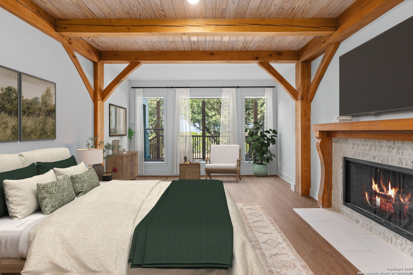 101 Ranch View Boerne, TX 78006 - Photo 34 of 63 a bedroom with a large bed and a fireplace