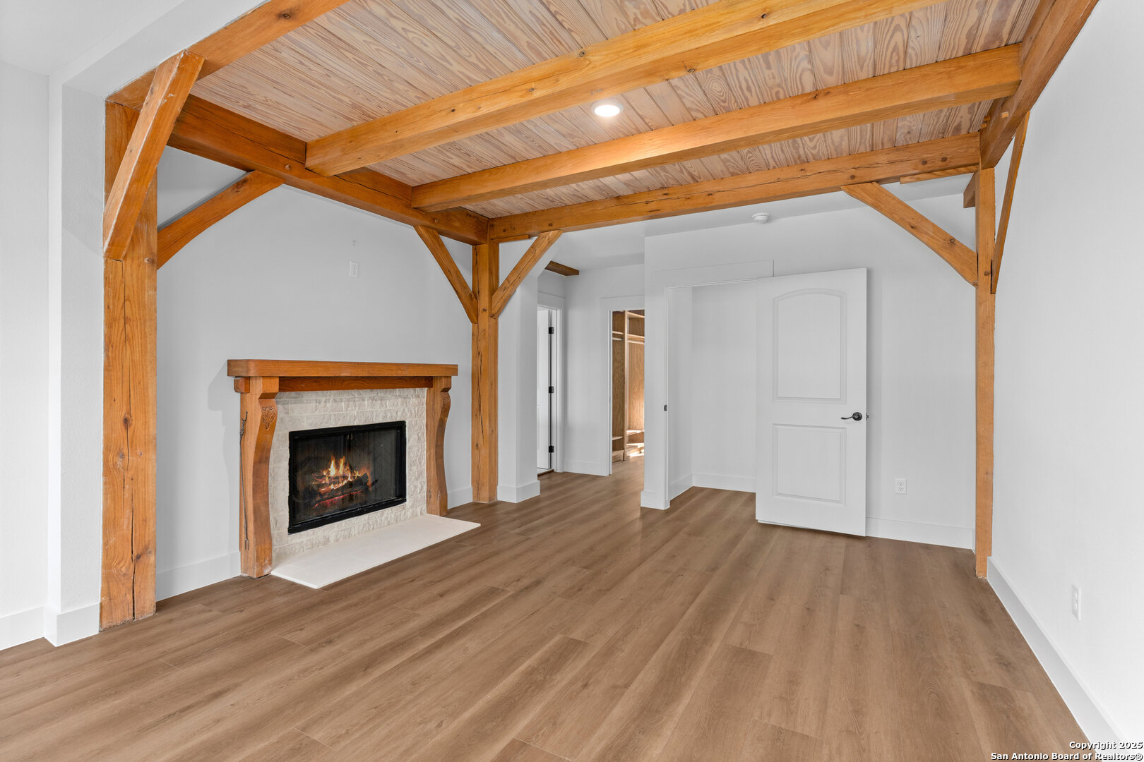 101 Ranch View Boerne, TX 78006 - Photo 35 of 63 a view of empty room with wooden floor and fireplace