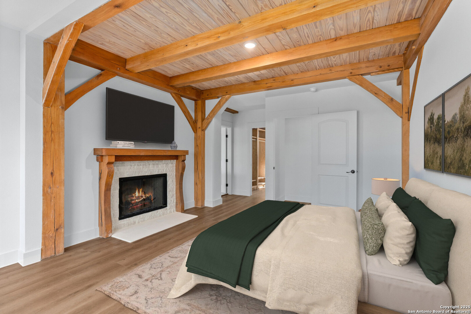 101 Ranch View Boerne, TX 78006 - Photo 36 of 63 a bedroom with a bed and a fireplace