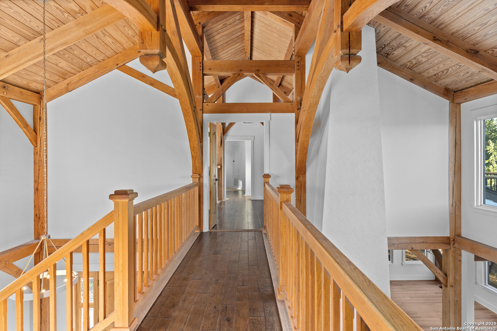 101 Ranch View Boerne, TX 78006 - Photo 50 of 63 a view of a hallway with wooden floor and stairs