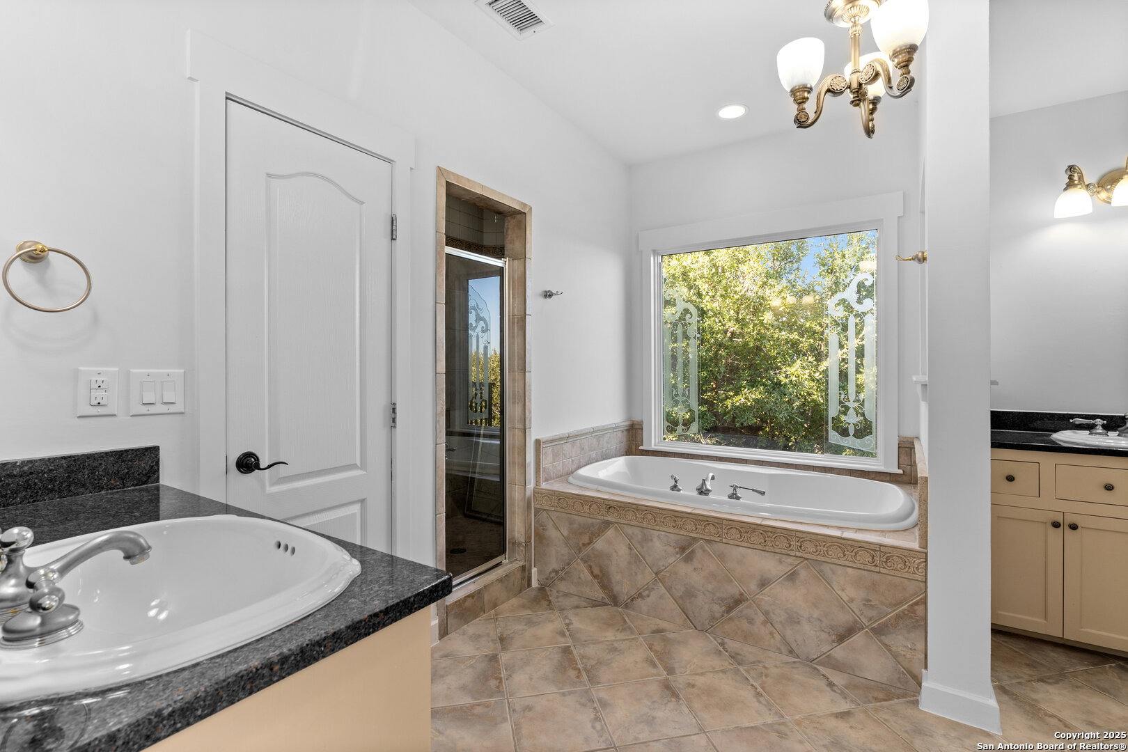 101 Ranch View Boerne, TX 78006 - Photo 56 of 63 a spacious bathroom with a tub sink and mirror