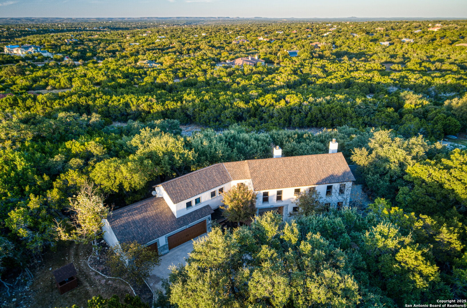 101 Ranch View Boerne, TX 78006 - Photo 10 of 63 an aerial view of a house with a yard swimming pool outdoor seating and lake view