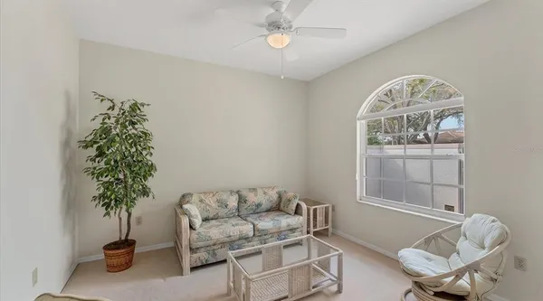 a living room with furniture and a window