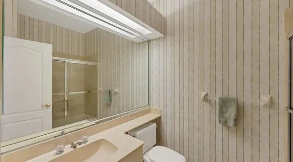 a bathroom with a sink and mirror