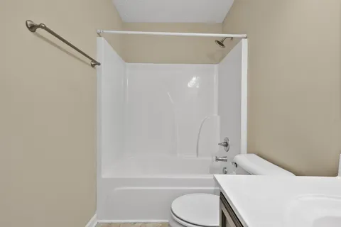 an empty room with a empty space and natural light