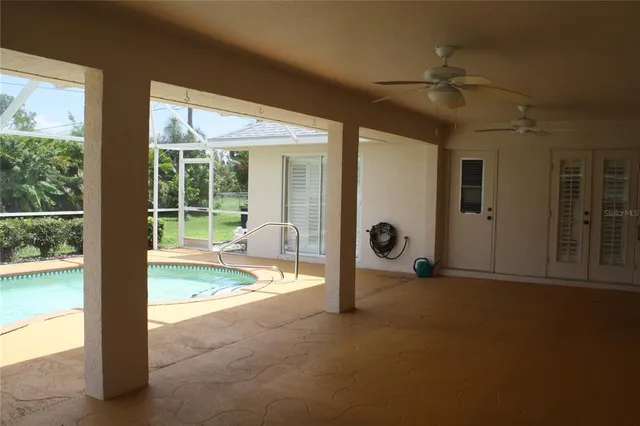 a view of a swimming pool with a yard