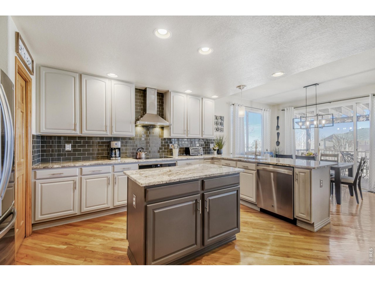 6350 Wier Way Arvada, CO 80403 - Photo 13 of 38 a kitchen with cabinets and sink