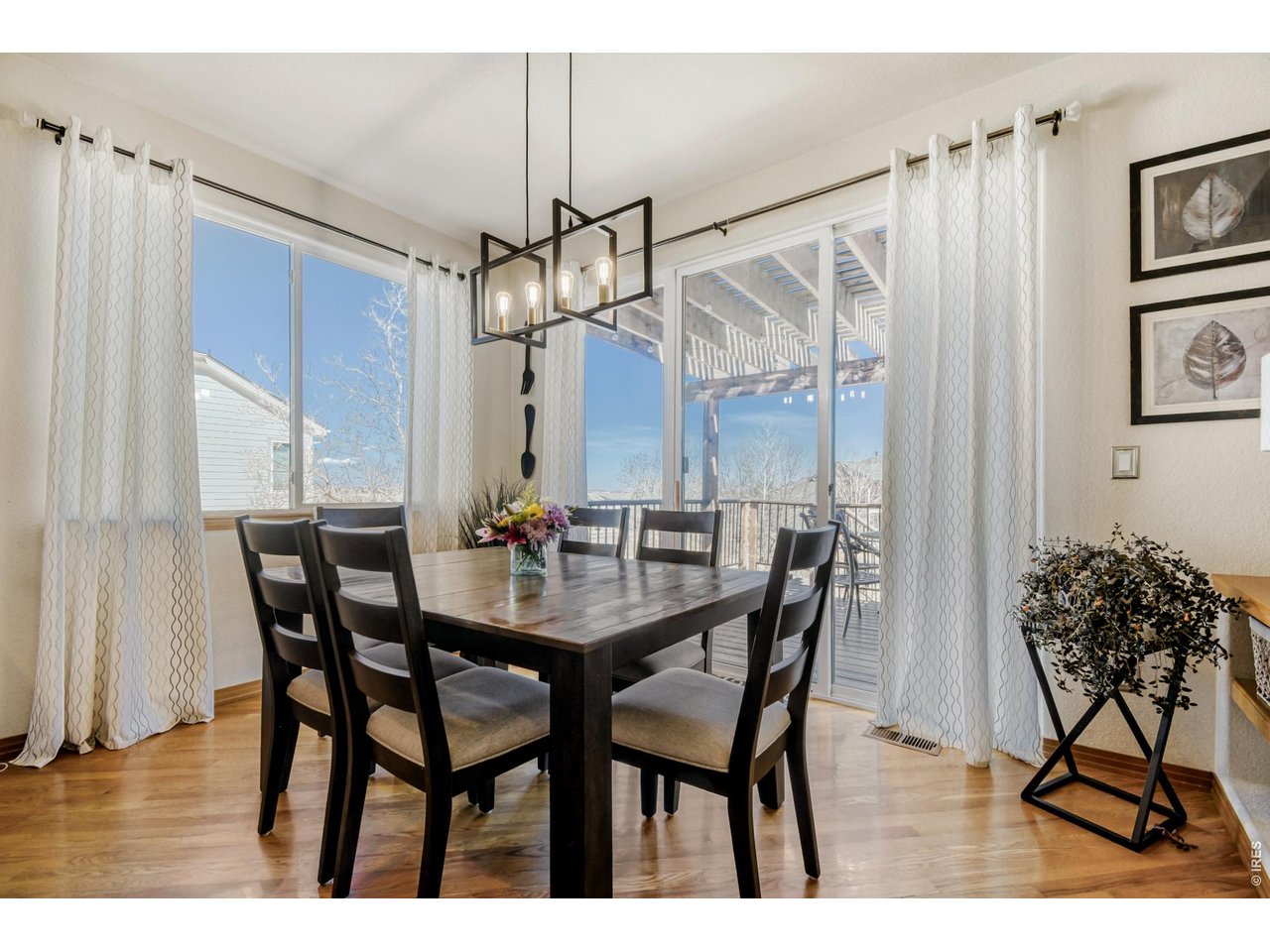 6350 Wier Way Arvada, CO 80403 - Photo 17 of 38 a view of a dining room with furniture and wooden floor