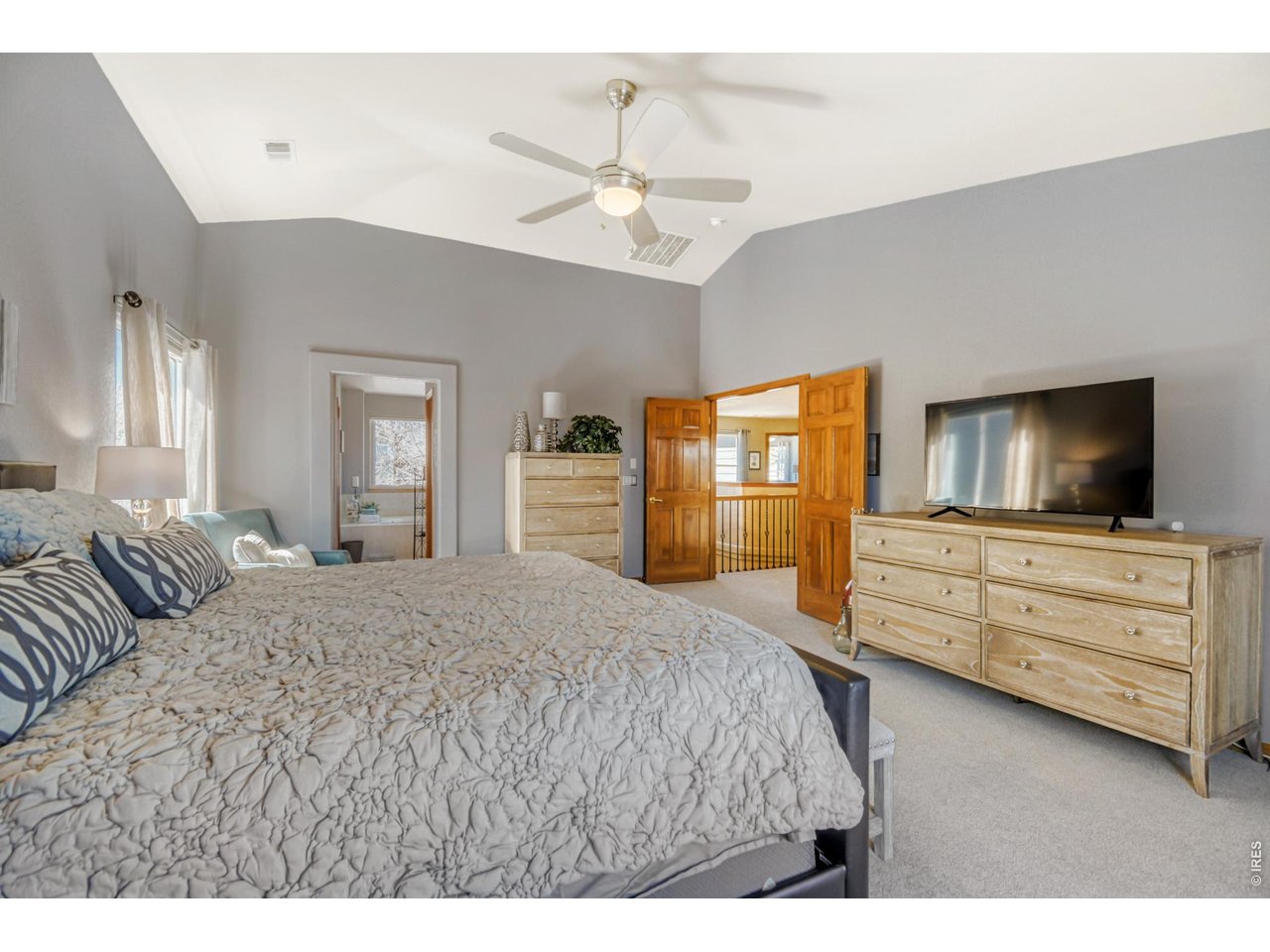 6350 Wier Way Arvada, CO 80403 - Photo 20 of 38 a bedroom with a bed and a dresser