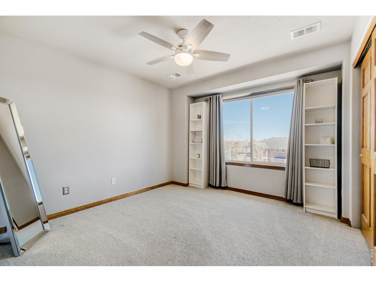6350 Wier Way Arvada, CO 80403 - Photo 30 of 38 a view of an empty room with a window