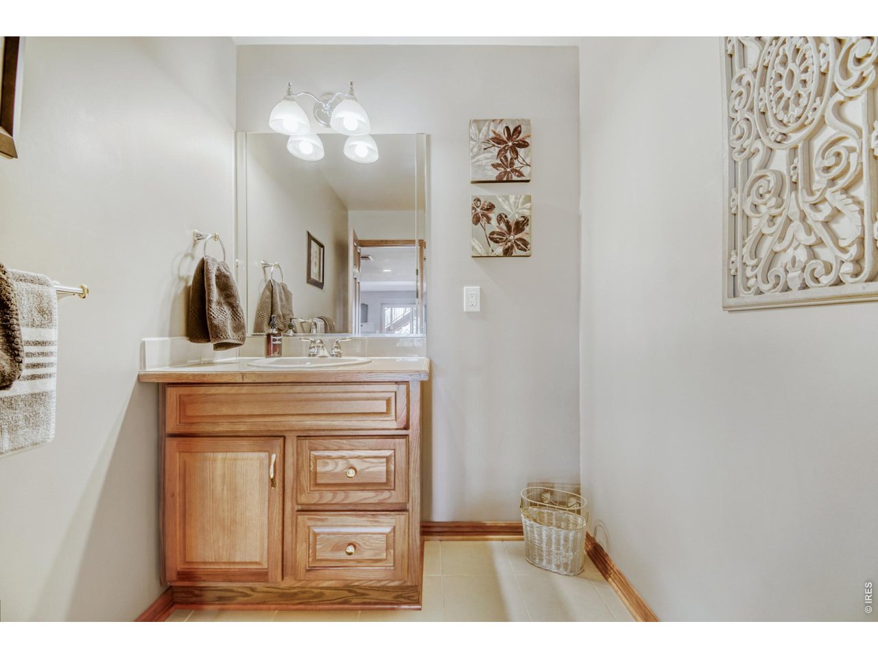 6350 Wier Way Arvada, CO 80403 - Photo 36 of 38 a bathroom with a sink vanity and a mirror
