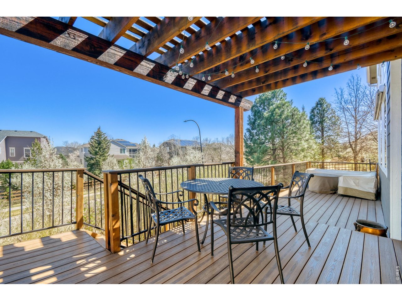 6350 Wier Way Arvada, CO 80403 - Photo 37 of 38 a view of balcony with furniture and wooden floor