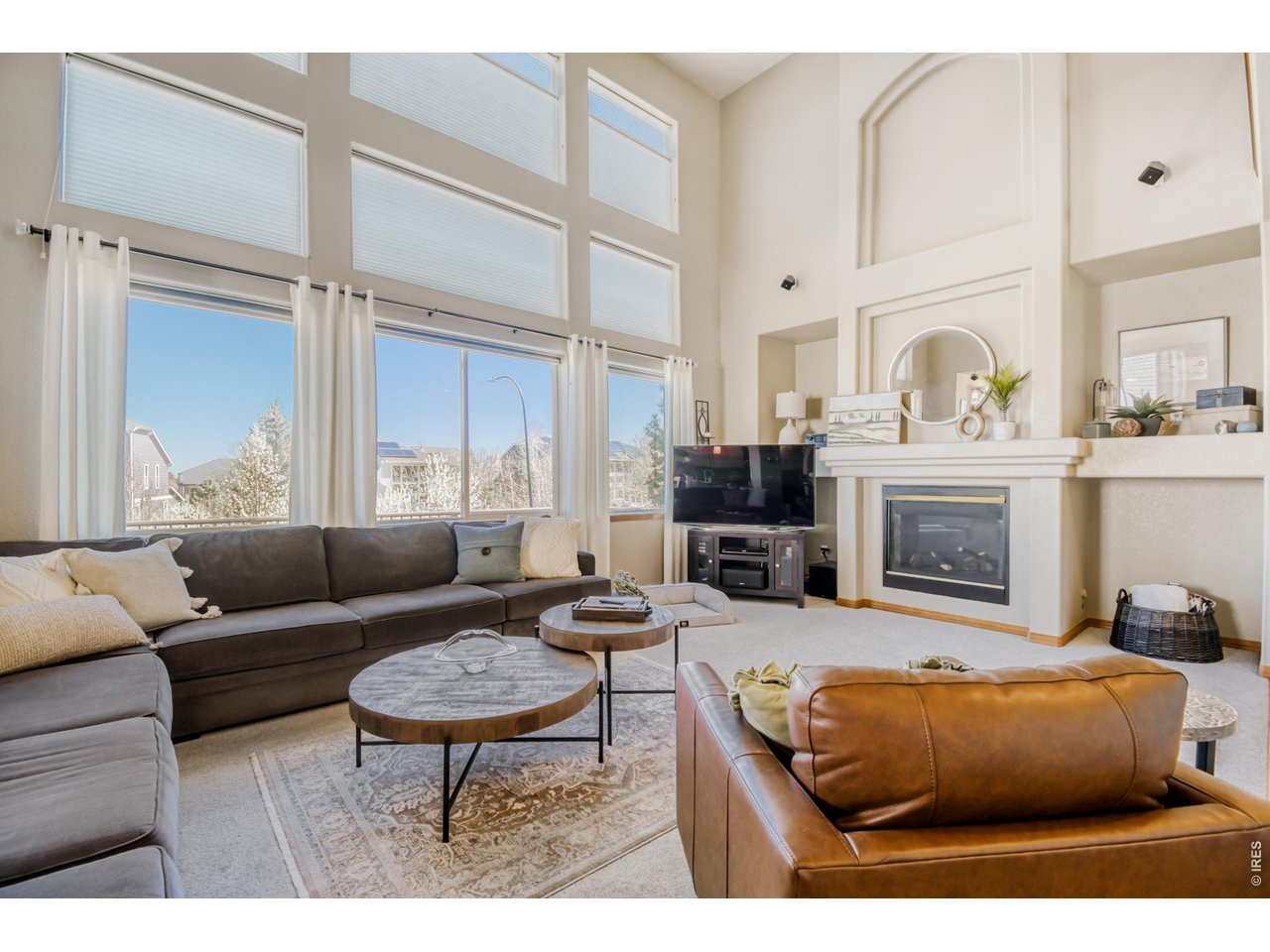 6350 Wier Way Arvada, CO 80403 - Photo 6 of 38 a living room with furniture and a fireplace
