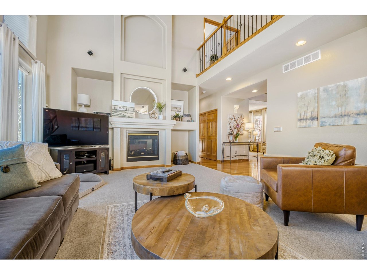 6350 Wier Way Arvada, CO 80403 - Photo 7 of 38 a living room with furniture and a fireplace