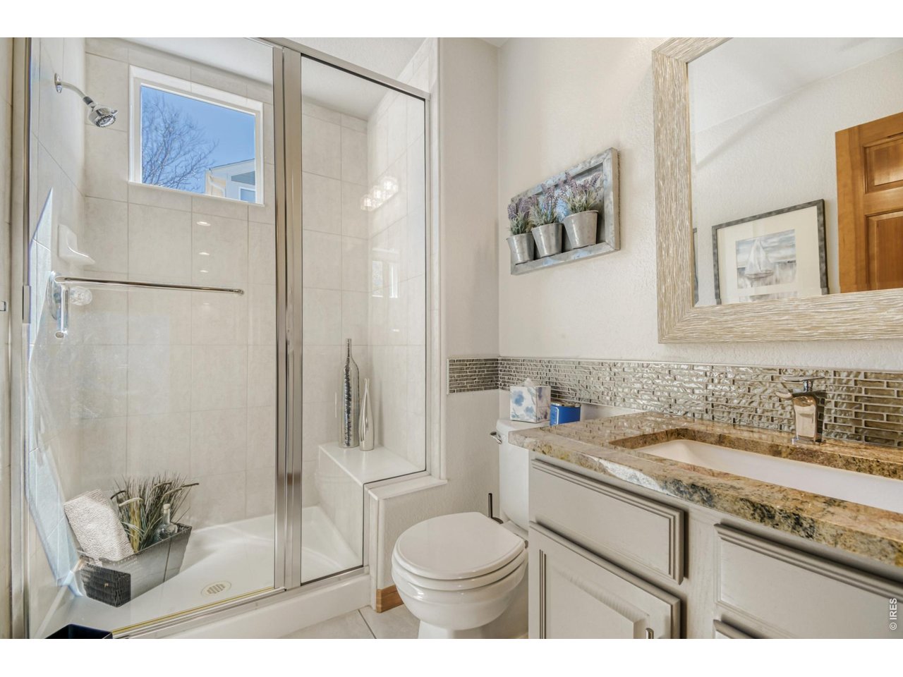 6350 Wier Way Arvada, CO 80403 - Photo 10 of 38 a bathroom with a sink toilet and shower