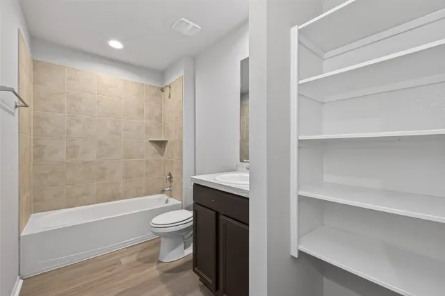a bathroom with a toilet a sink and bathtub