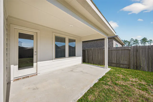 a view of backyard with small cabin