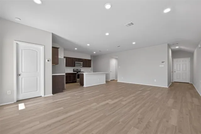 a view of kitchen with wooden floor