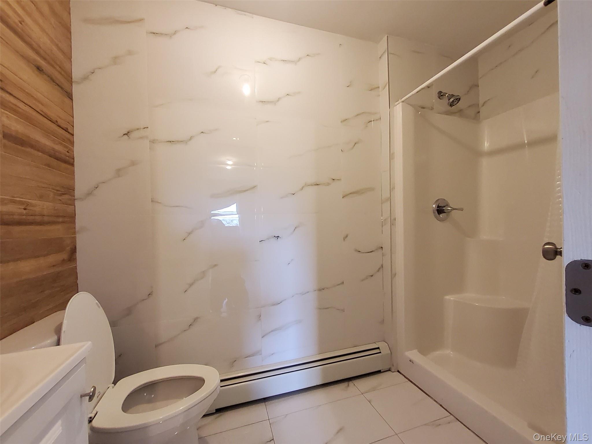 469 Hillside Road Monroe, NY 10950 - Photo 12 of 20 a bathroom with a shower a toilet and sink