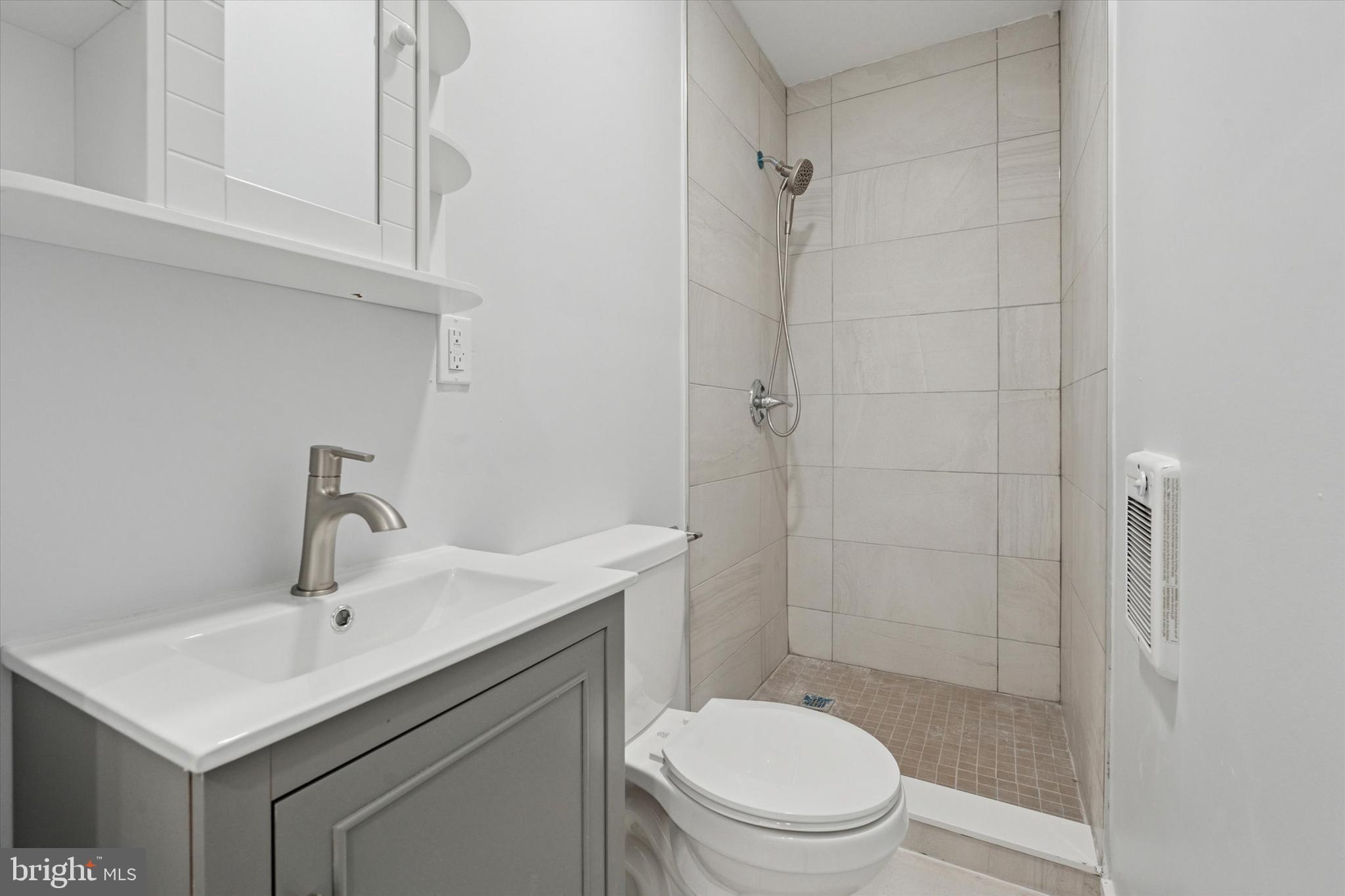 251 South 44th Street, Unit 2 Philadelphia, PA 19104 - Photo 11 of 12 a bathroom with a sink toilet and shower