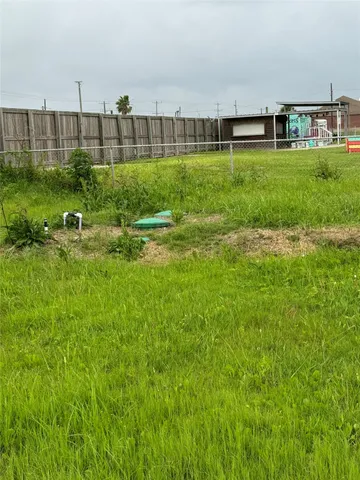 a view of a garden with a building in the background