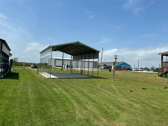 a view of yard with swimming pool